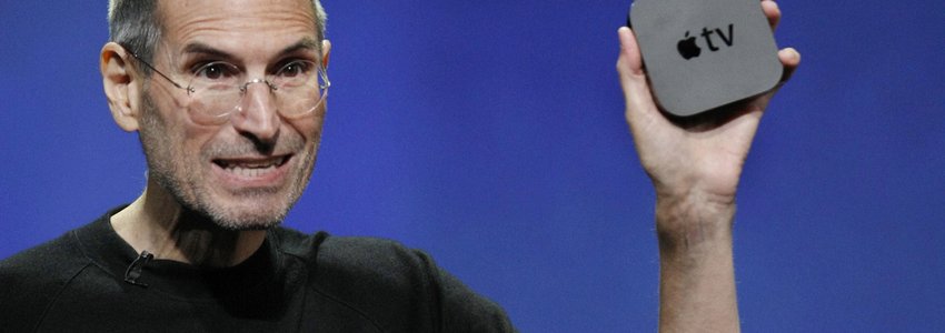 Steve Jobs holding an Apple TV